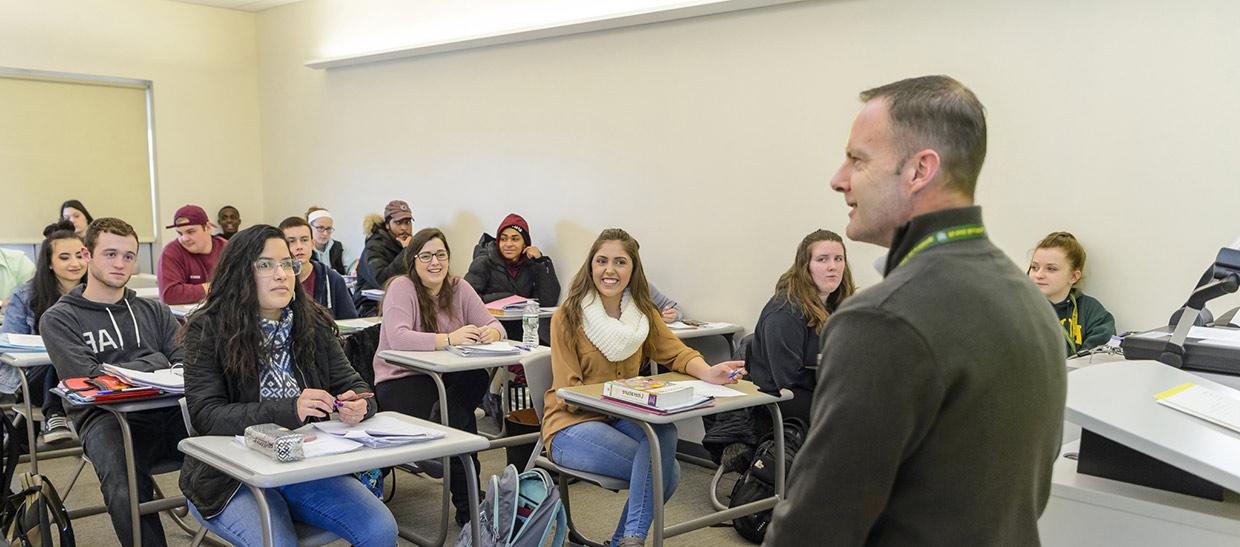 Professor talking to class full of students